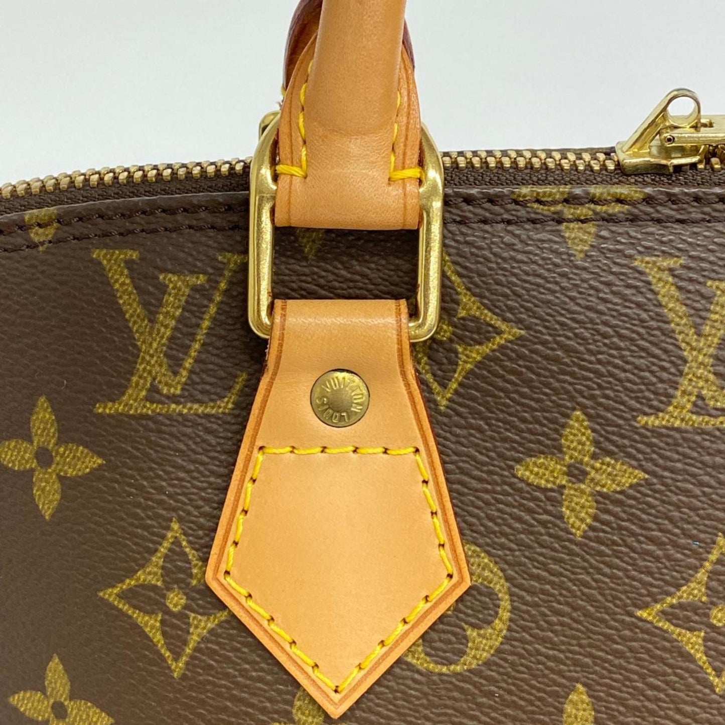 LOUIS VUITTON Alma Handbag