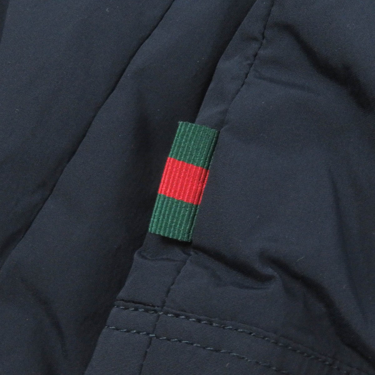 GUCCI Down jacket 322555 Main: 92% nylon, Main: 8% polyurethane, Part: 98% wool, Part: 2% polyurethane, Filling: 100% down Navy mens 44 Used
