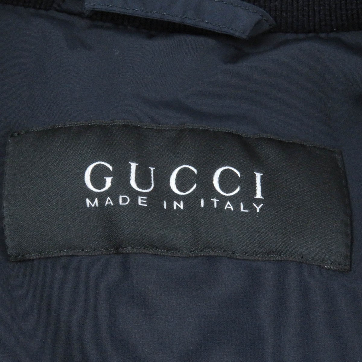 GUCCI Down jacket 322555 Main: 92% nylon, Main: 8% polyurethane, Part: 98% wool, Part: 2% polyurethane, Filling: 100% down Navy mens 44 Used