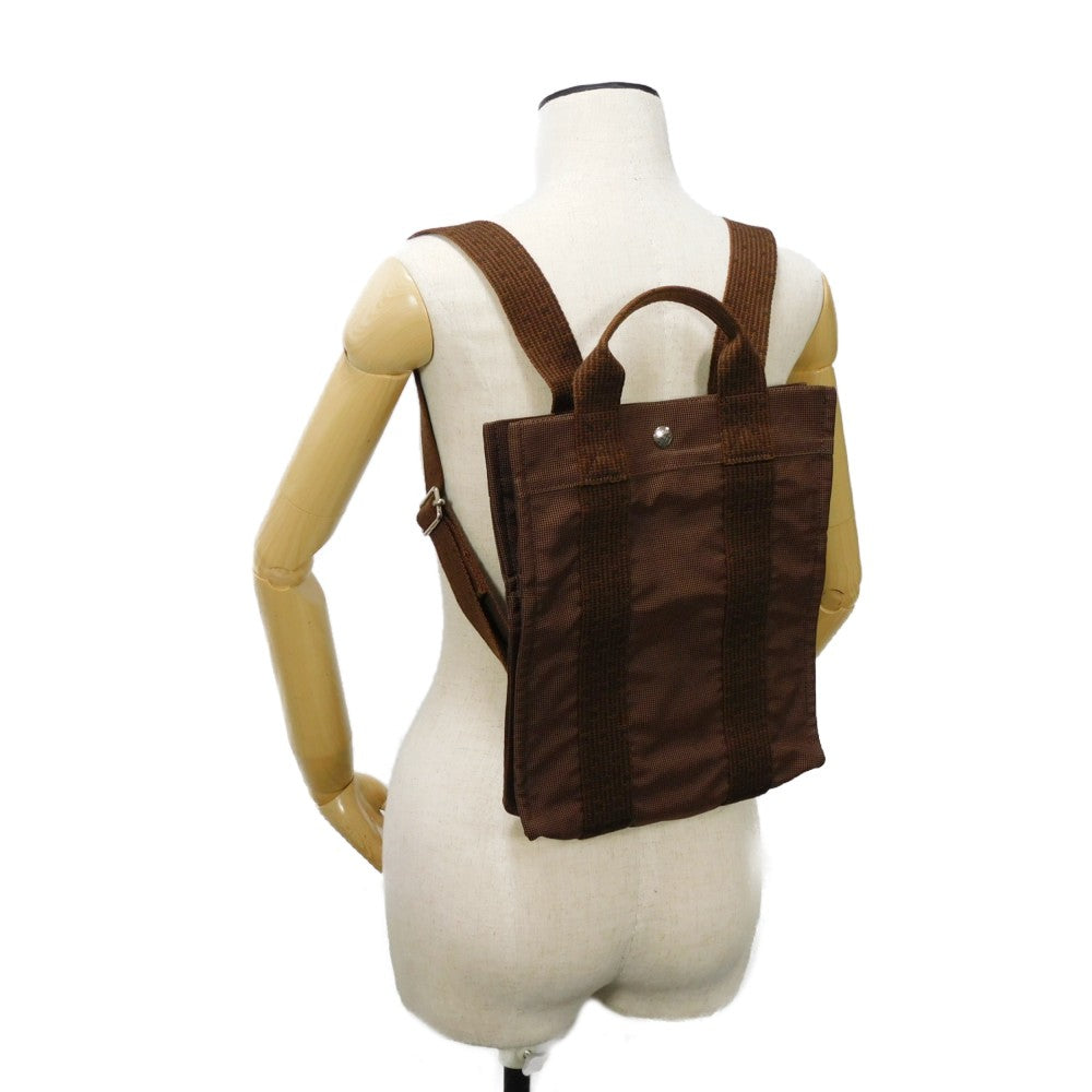 HERMES Backpack Nylon canvas (polyamide x polyester) Brown Serie button Her Line Sac Ad PM mens(Unisex) Used