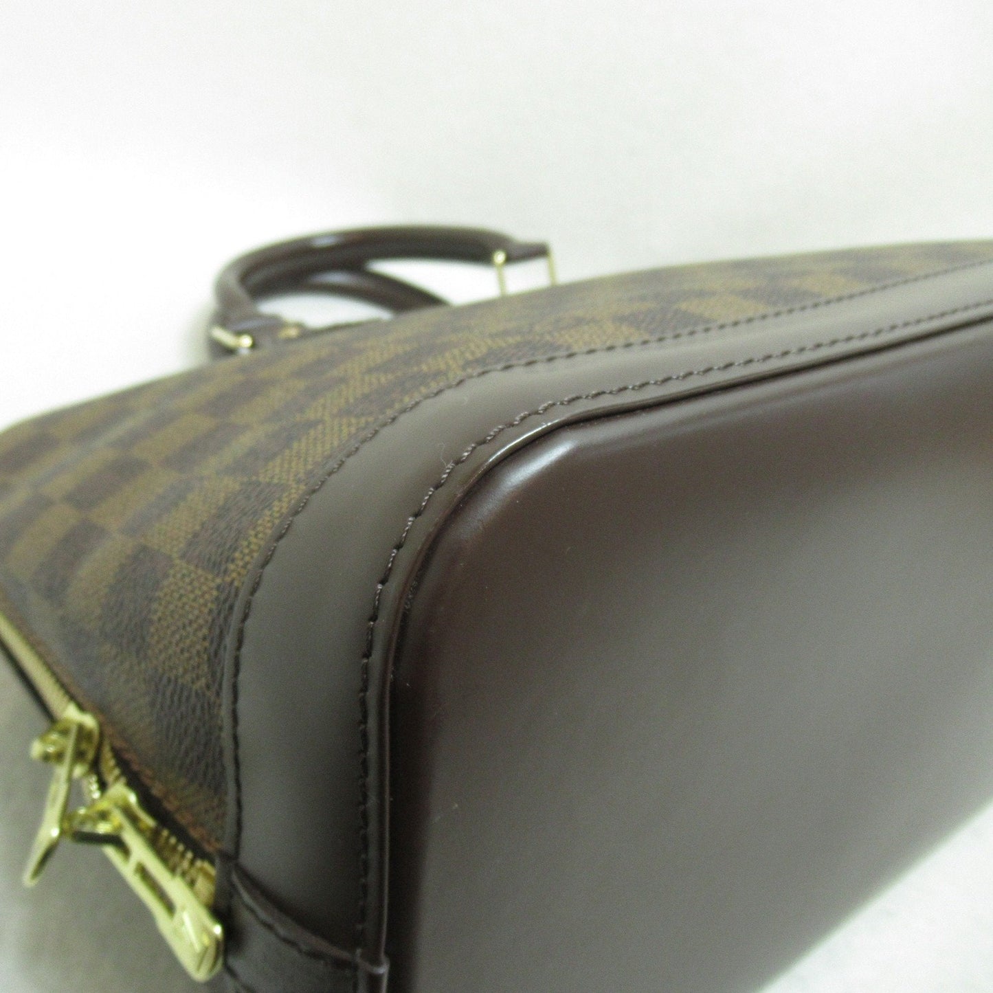 LOUIS VUITTON Alma Handbag
