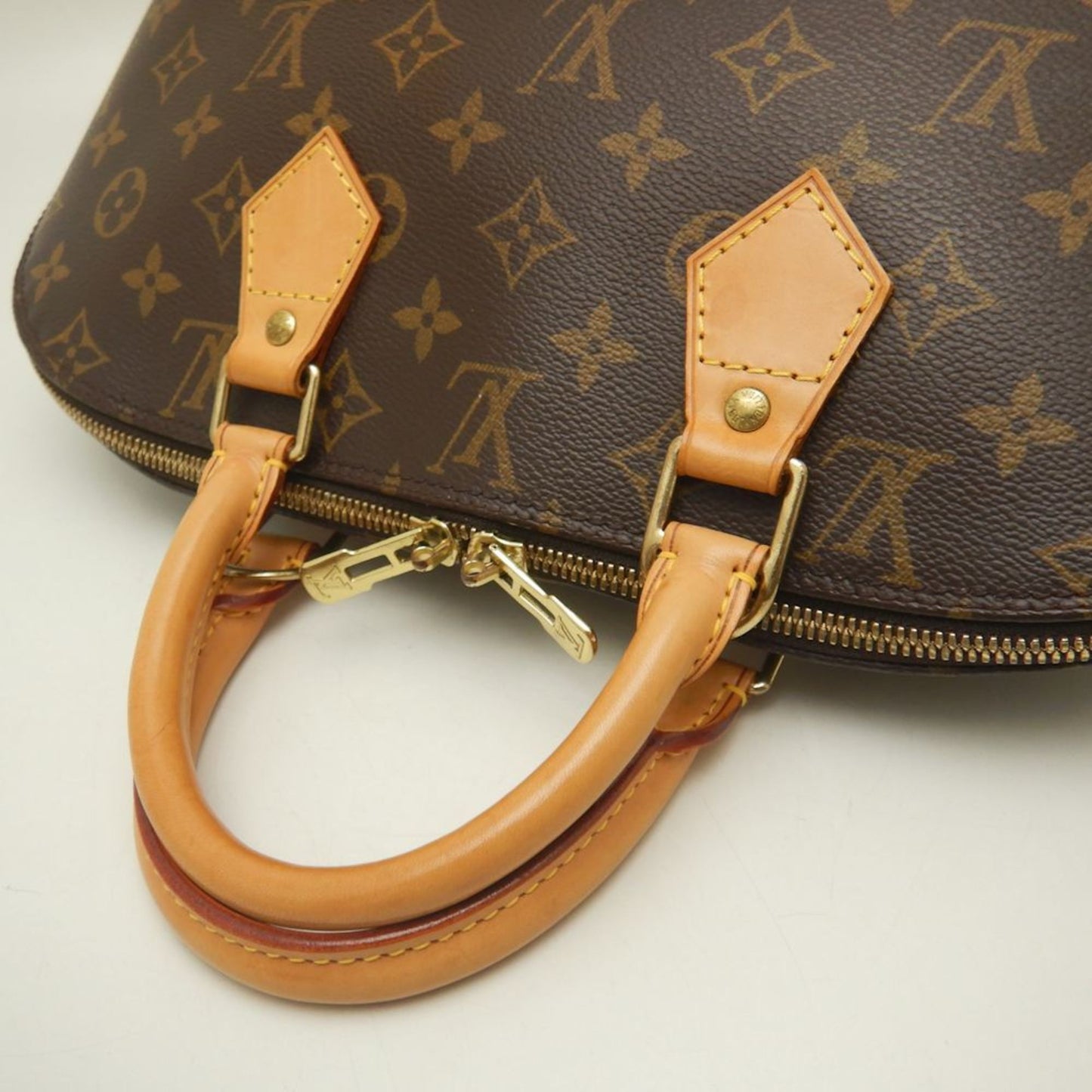 LOUIS VUITTON Alma Handbag