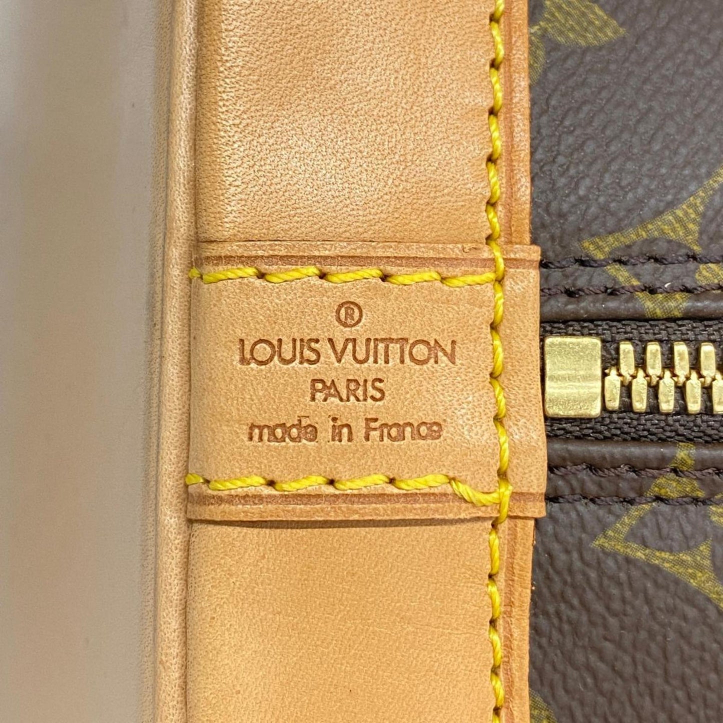 LOUIS VUITTON Alma Handbag