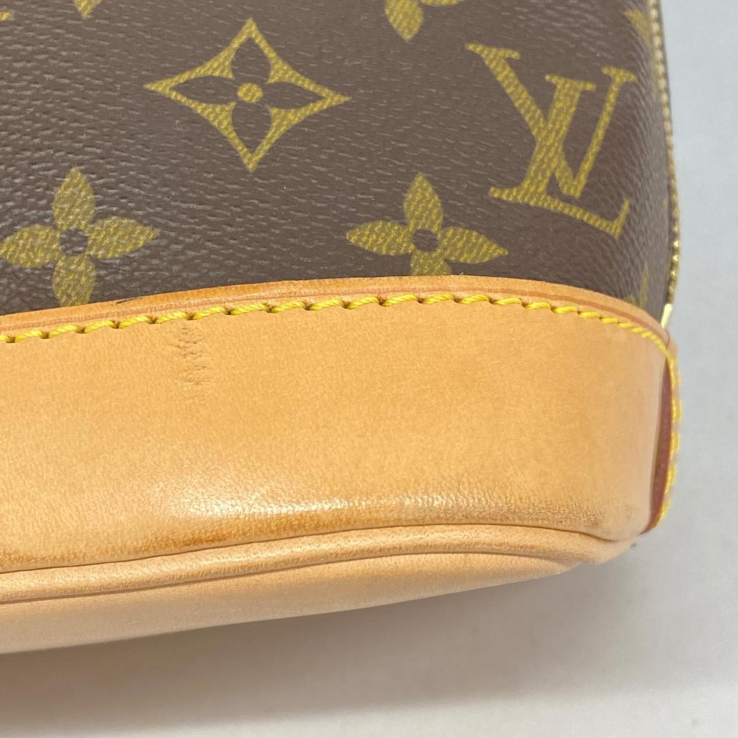 LOUIS VUITTON Alma Handbag
