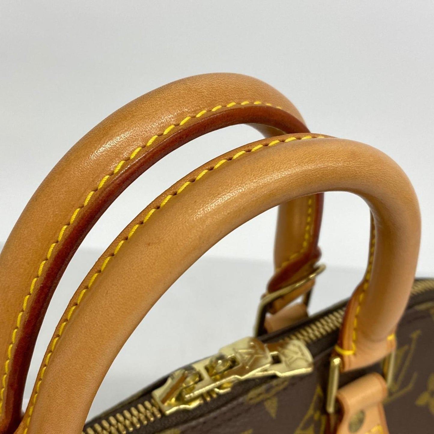 LOUIS VUITTON Alma Handbag