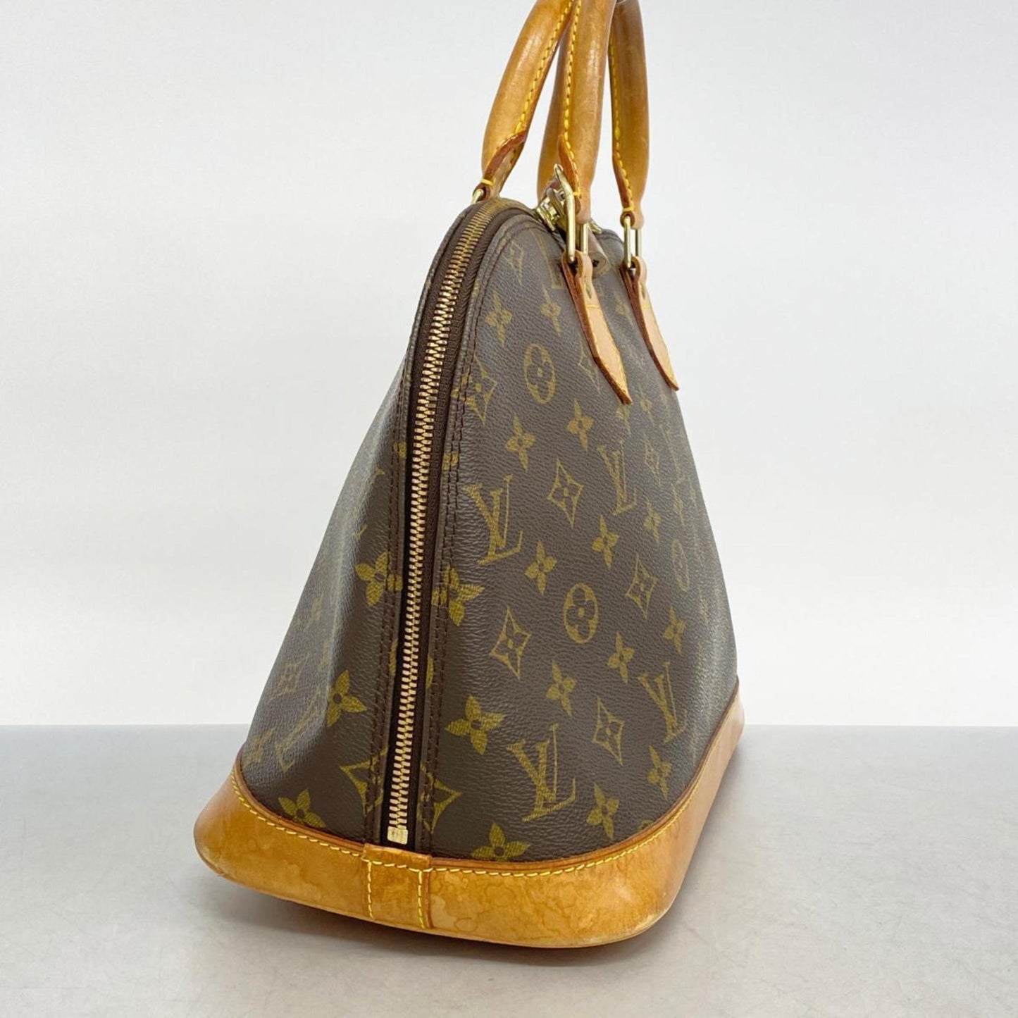 LOUIS VUITTON Alma Handbag