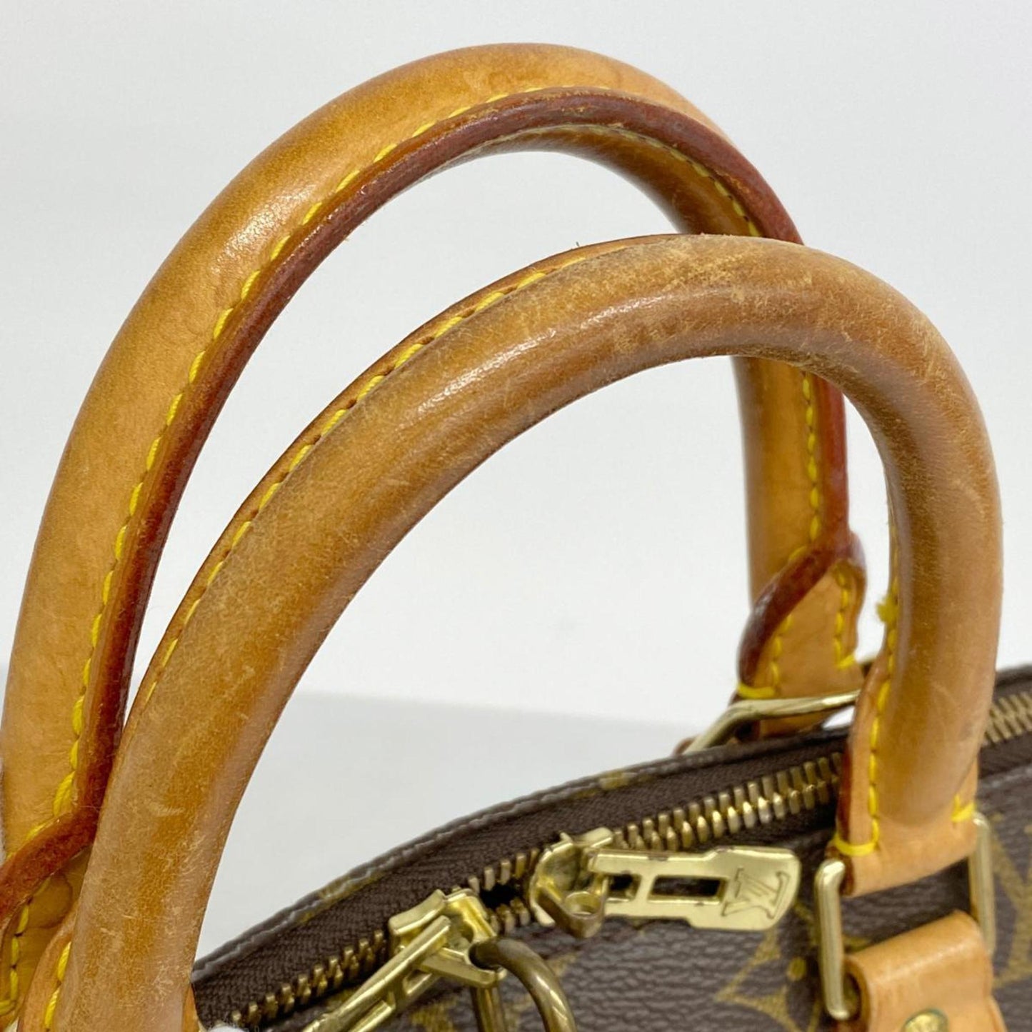 LOUIS VUITTON Alma Handbag