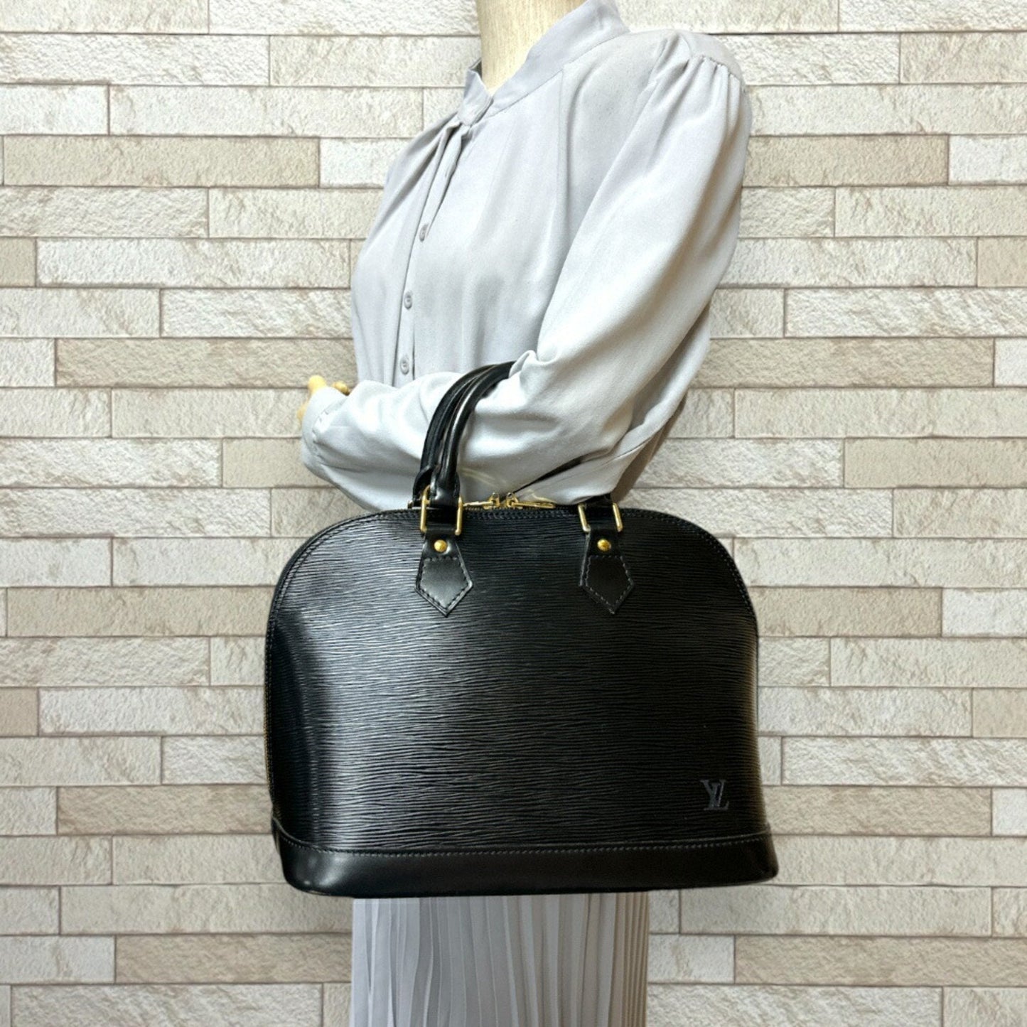LOUIS VUITTON Alma Handbag