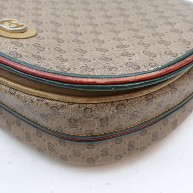 Gucci, rare, brown micro Guccissima print coated canvas/leather saddle bag with red and green inlaid leather stripes