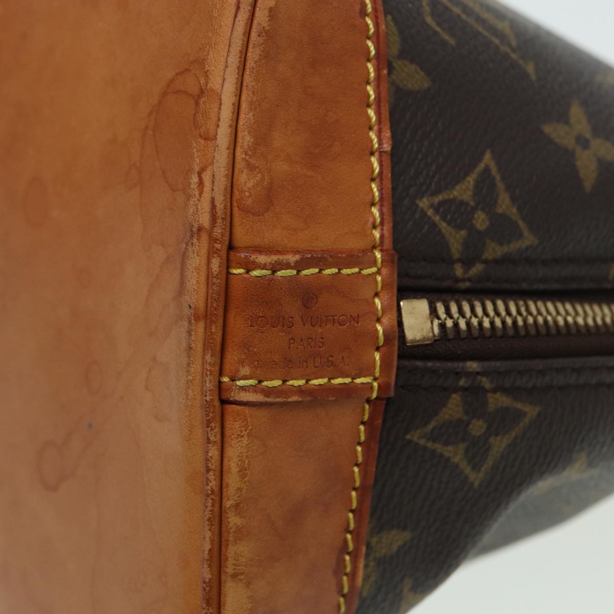 LOUIS VUITTON Alma Handbag