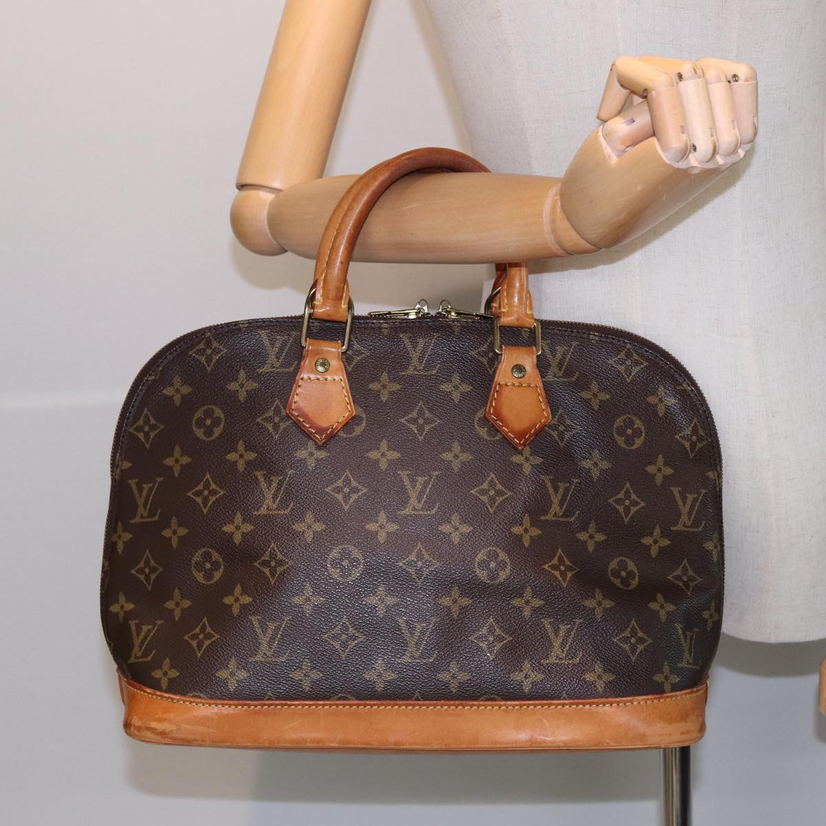 LOUIS VUITTON Alma Handbag