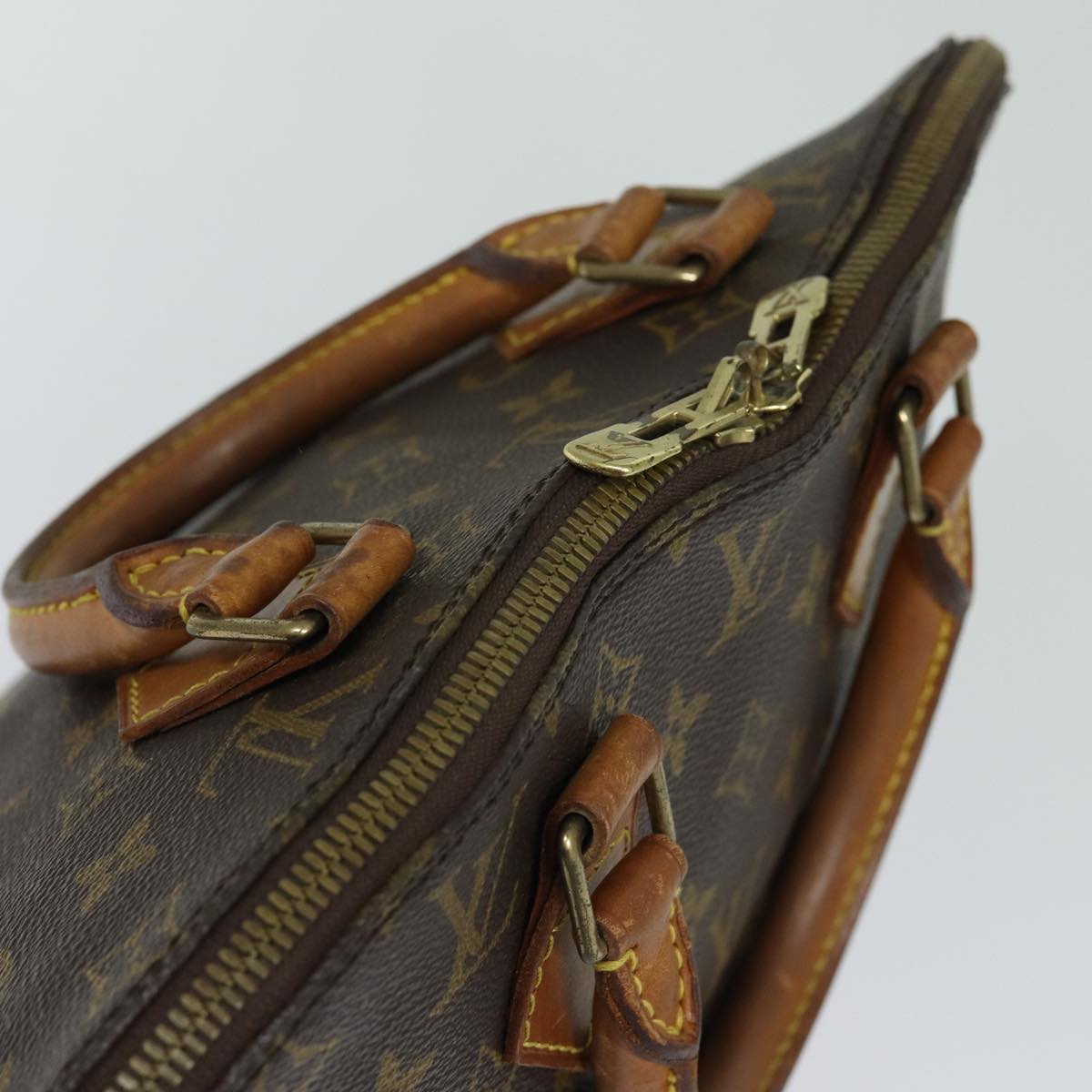 LOUIS VUITTON Alma Handbag