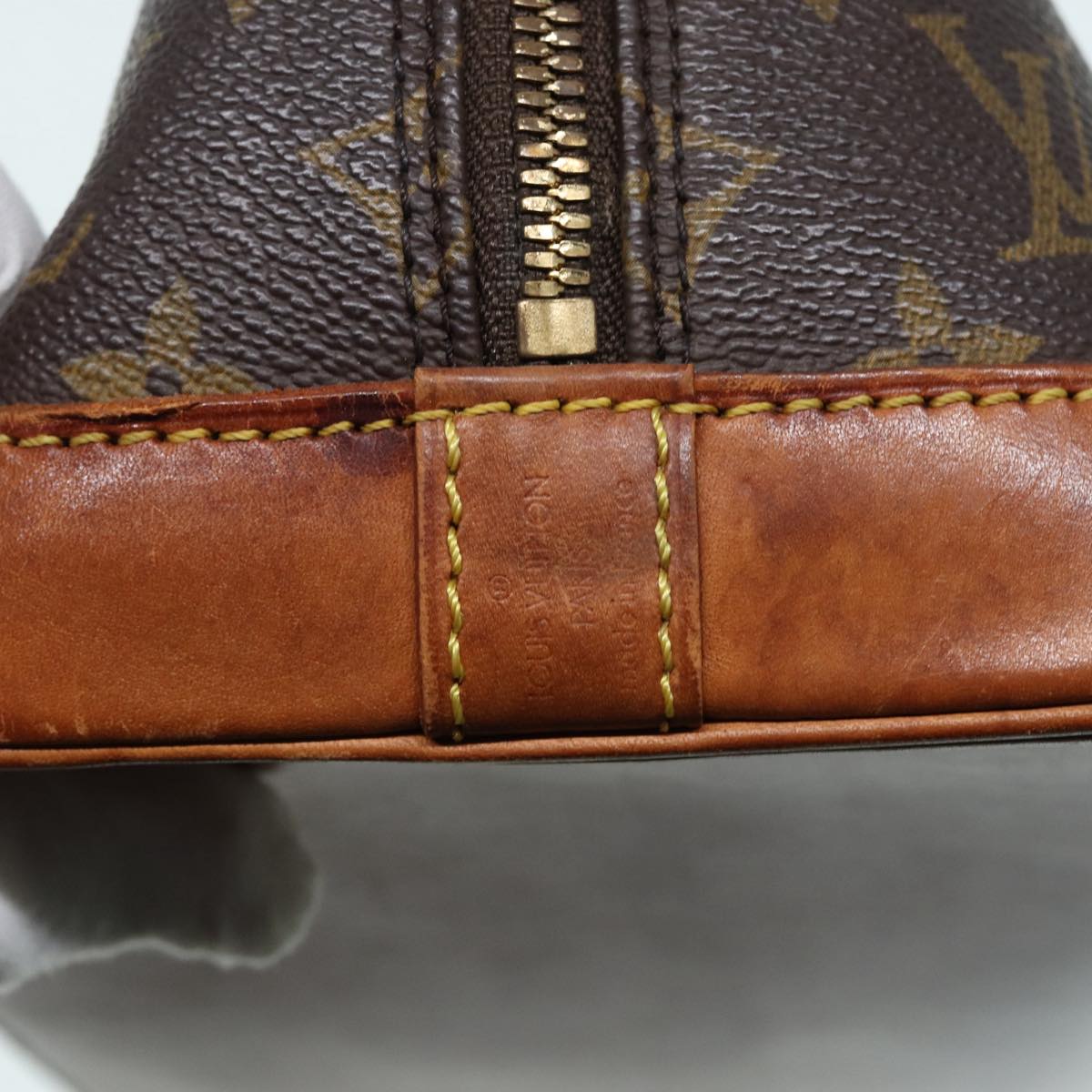 LOUIS VUITTON Alma Handbag