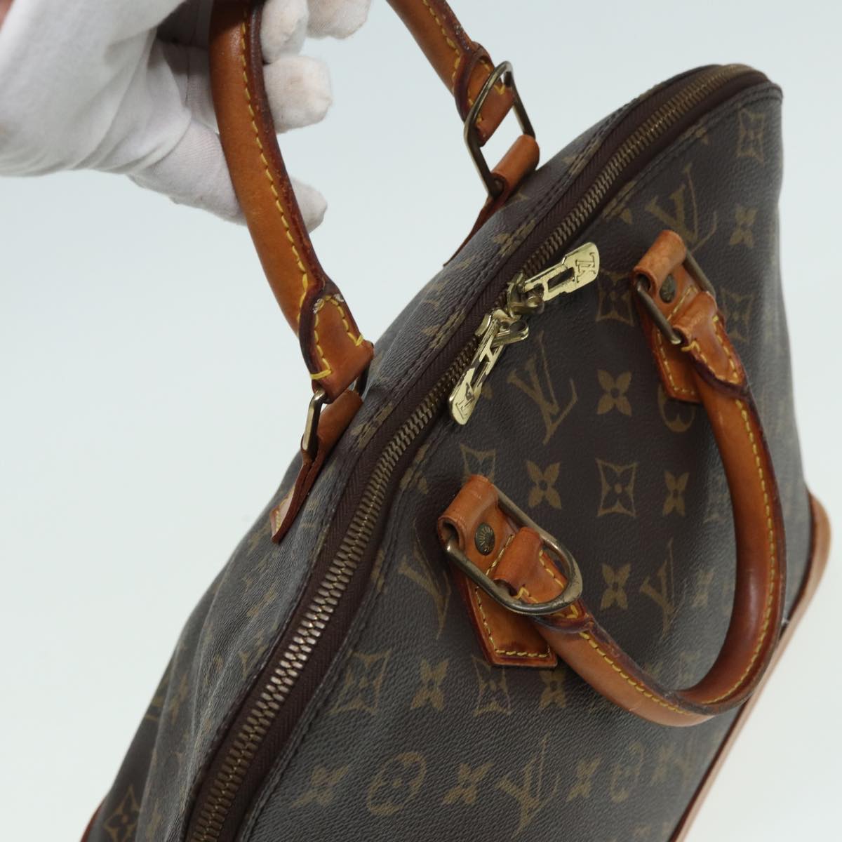 LOUIS VUITTON Alma Handbag