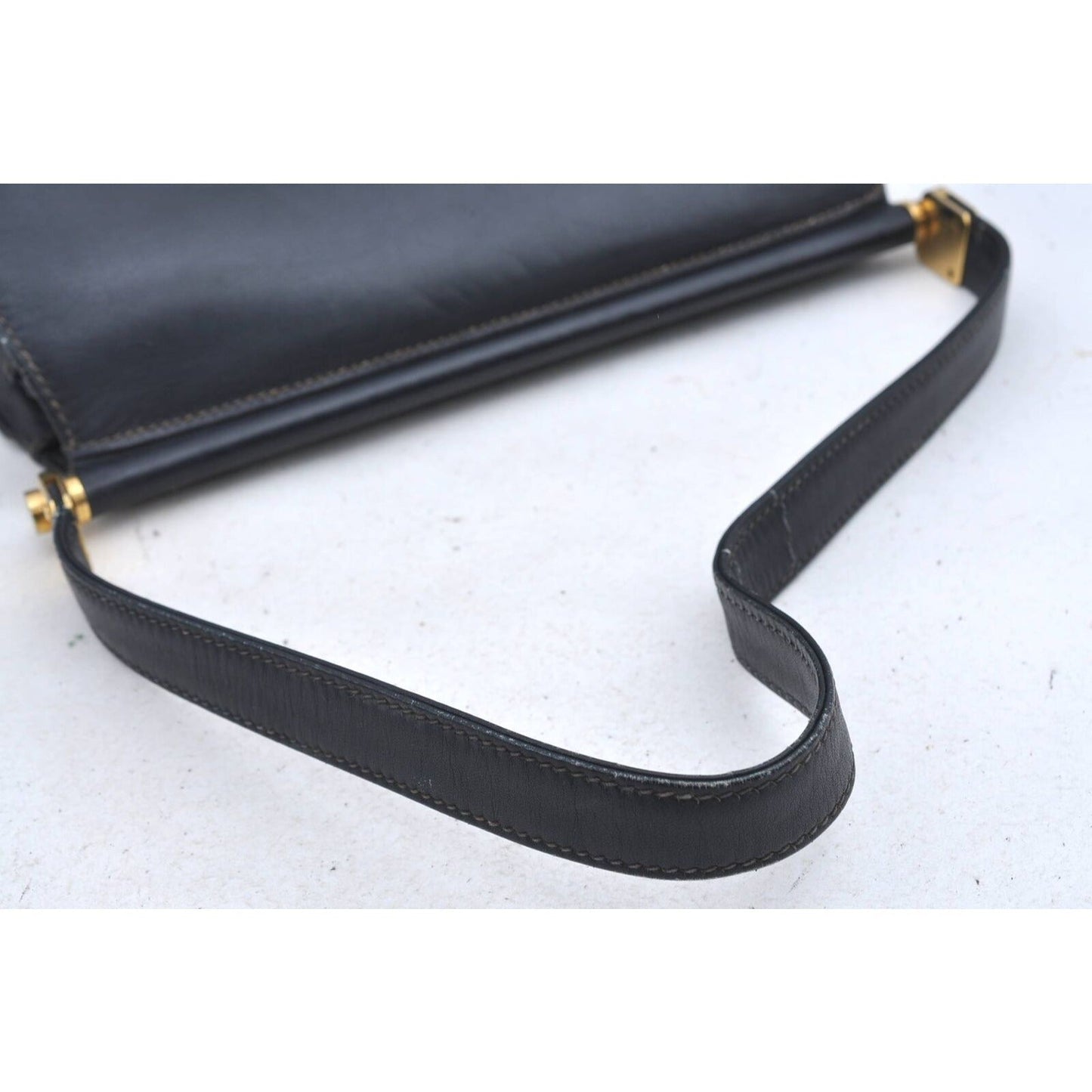 Gucci 60's navy leather saddle bag with gold logo clasp