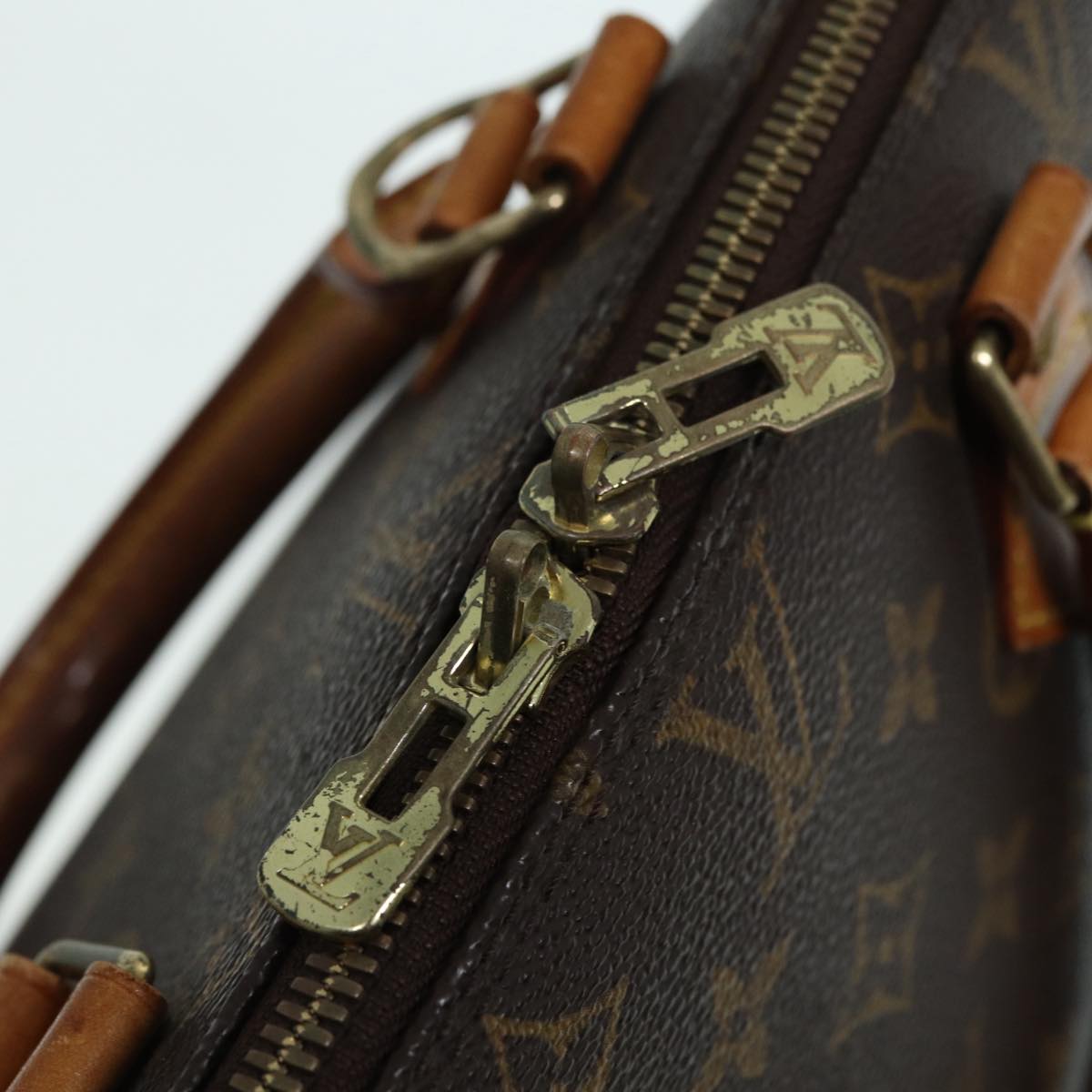 LOUIS VUITTON Alma Handbag