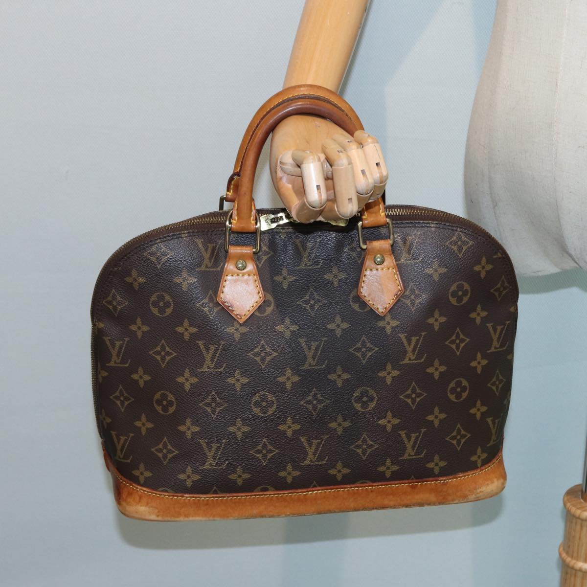 LOUIS VUITTON Alma Handbag