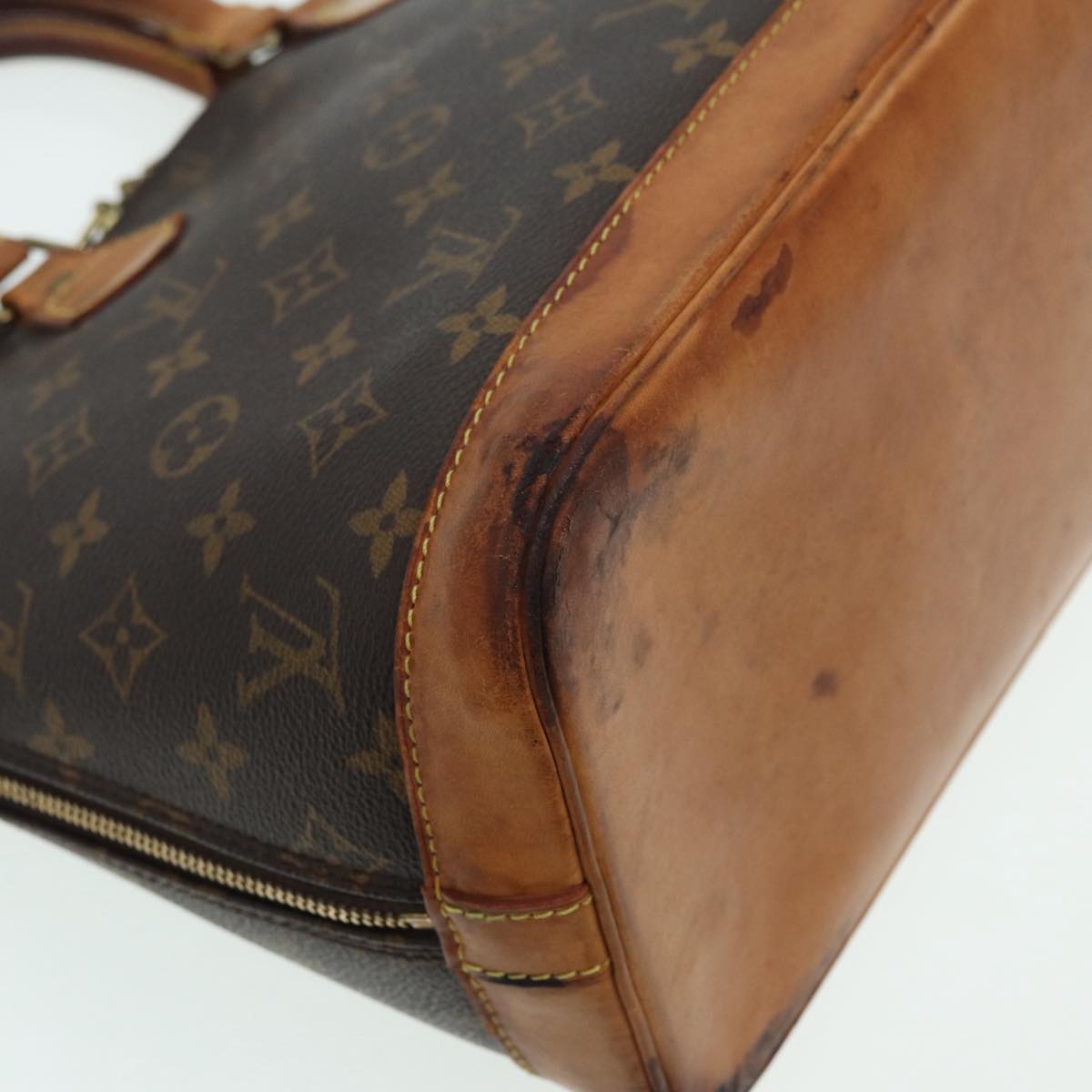 LOUIS VUITTON Alma Handbag
