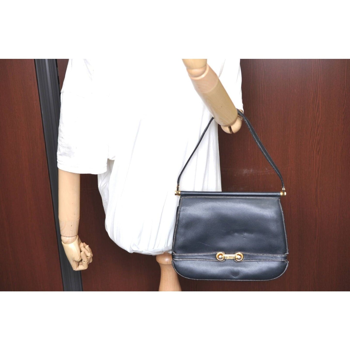 Gucci 60's navy leather saddle bag with gold logo clasp