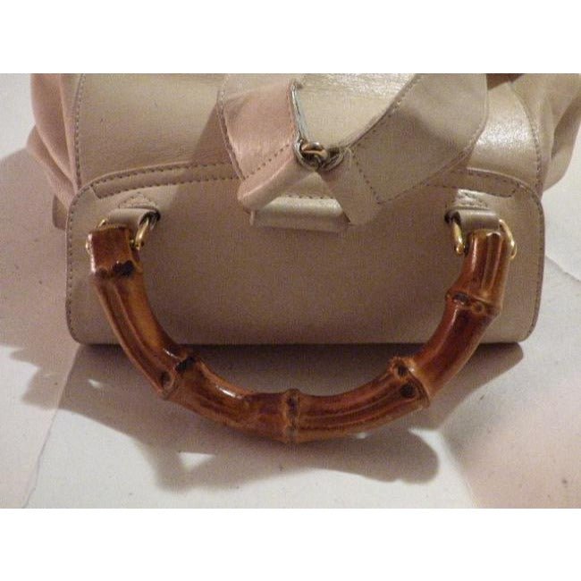 Gucci, white leather, larger size, two strap and bamboo handle, drawstring top, multi-pocket, messenger bag/backpack