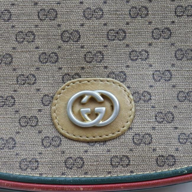 Gucci, rare, brown micro Guccissima print coated canvas/leather saddle bag with red and green inlaid leather stripes