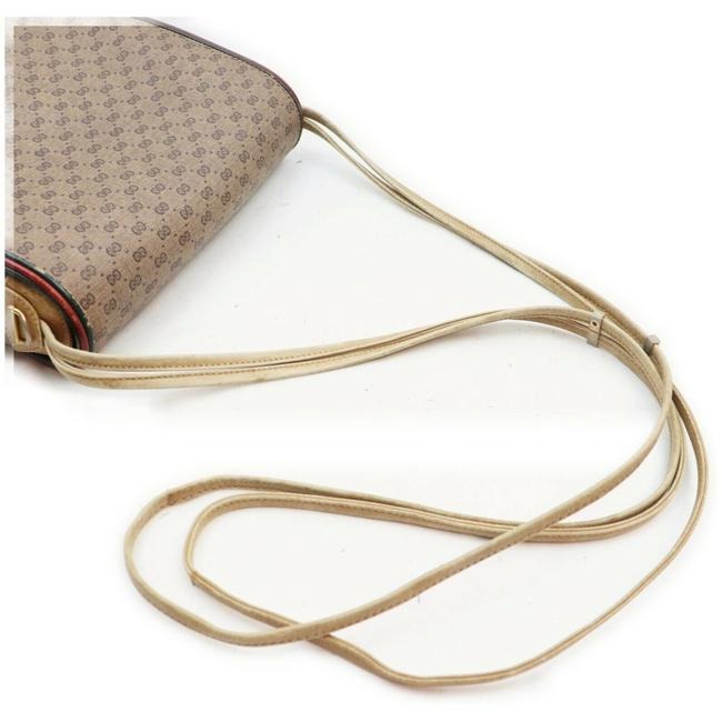 Gucci, rare, brown micro Guccissima print coated canvas/leather saddle bag with red and green inlaid leather stripes