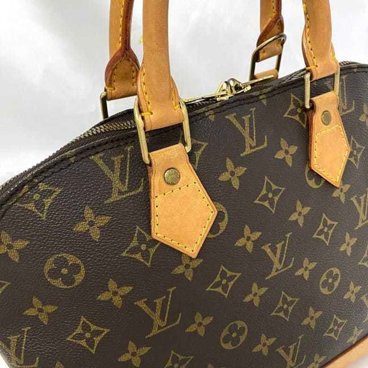 LOUIS VUITTON Alma Handbag