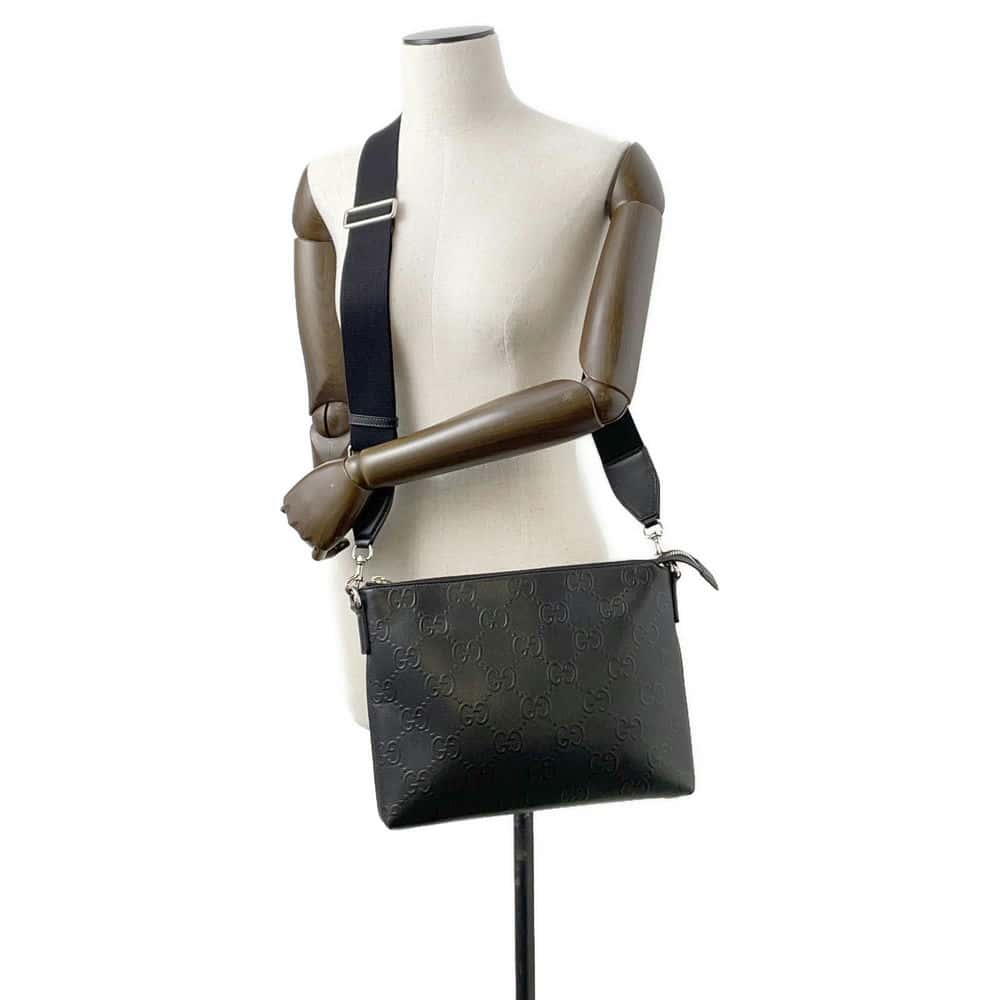 GUCCI GG-embossed messenger bag Black 696009 Leather