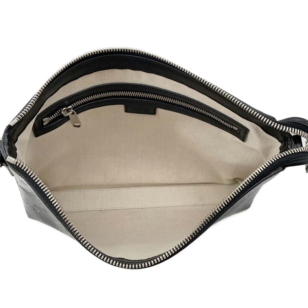 GUCCI GG-embossed messenger bag Black 696009 Leather