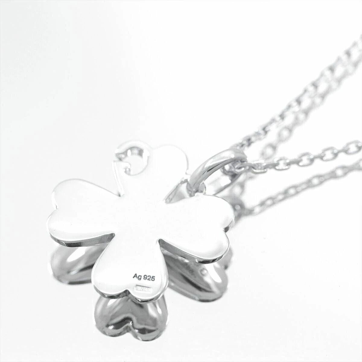 Gucci sterling silver four leaf clover pendant with G logo cut-out on an 18" chain