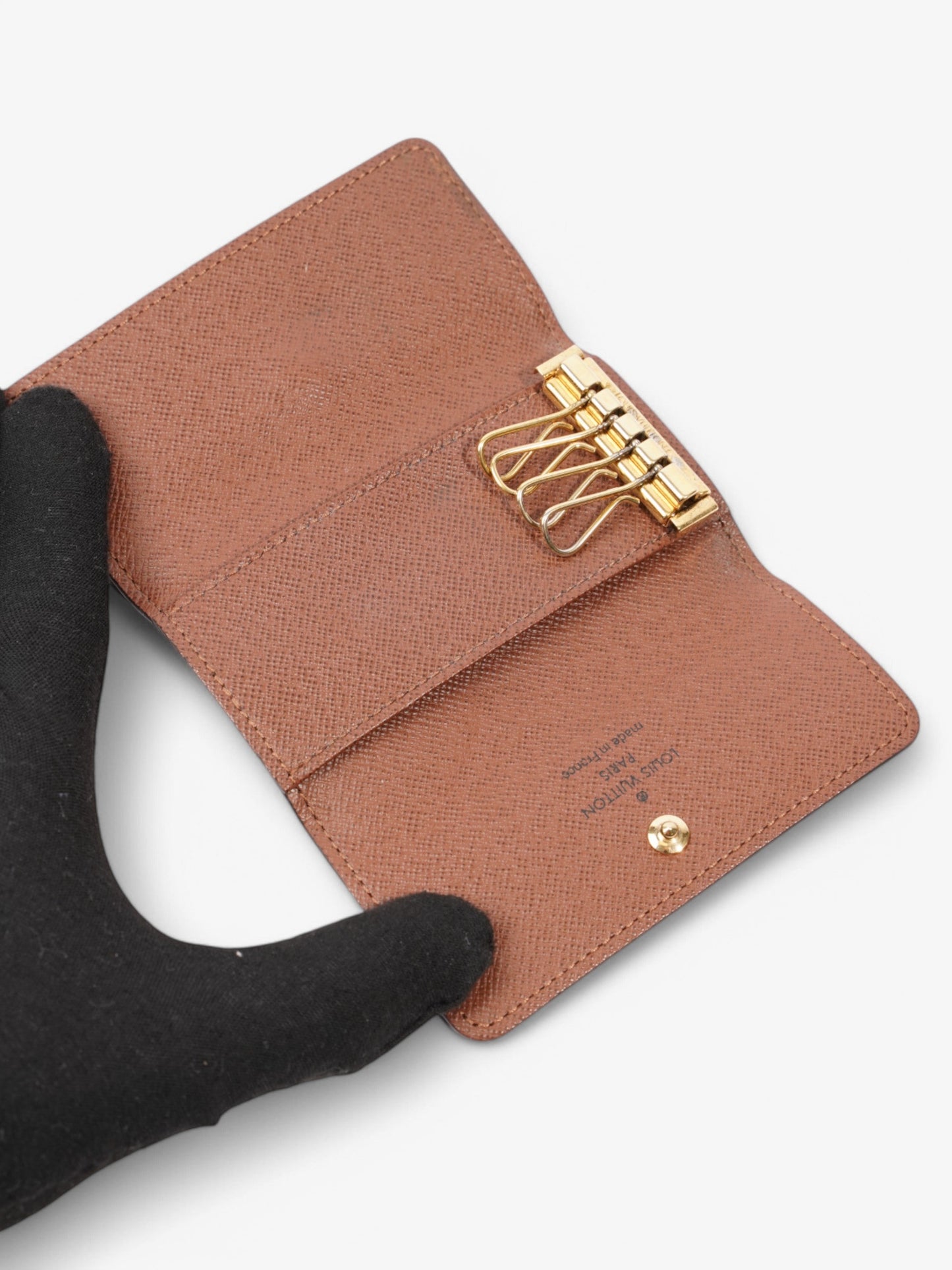Louis Vuitton 4 Key Holder Monogram / Gold Coated Canvas