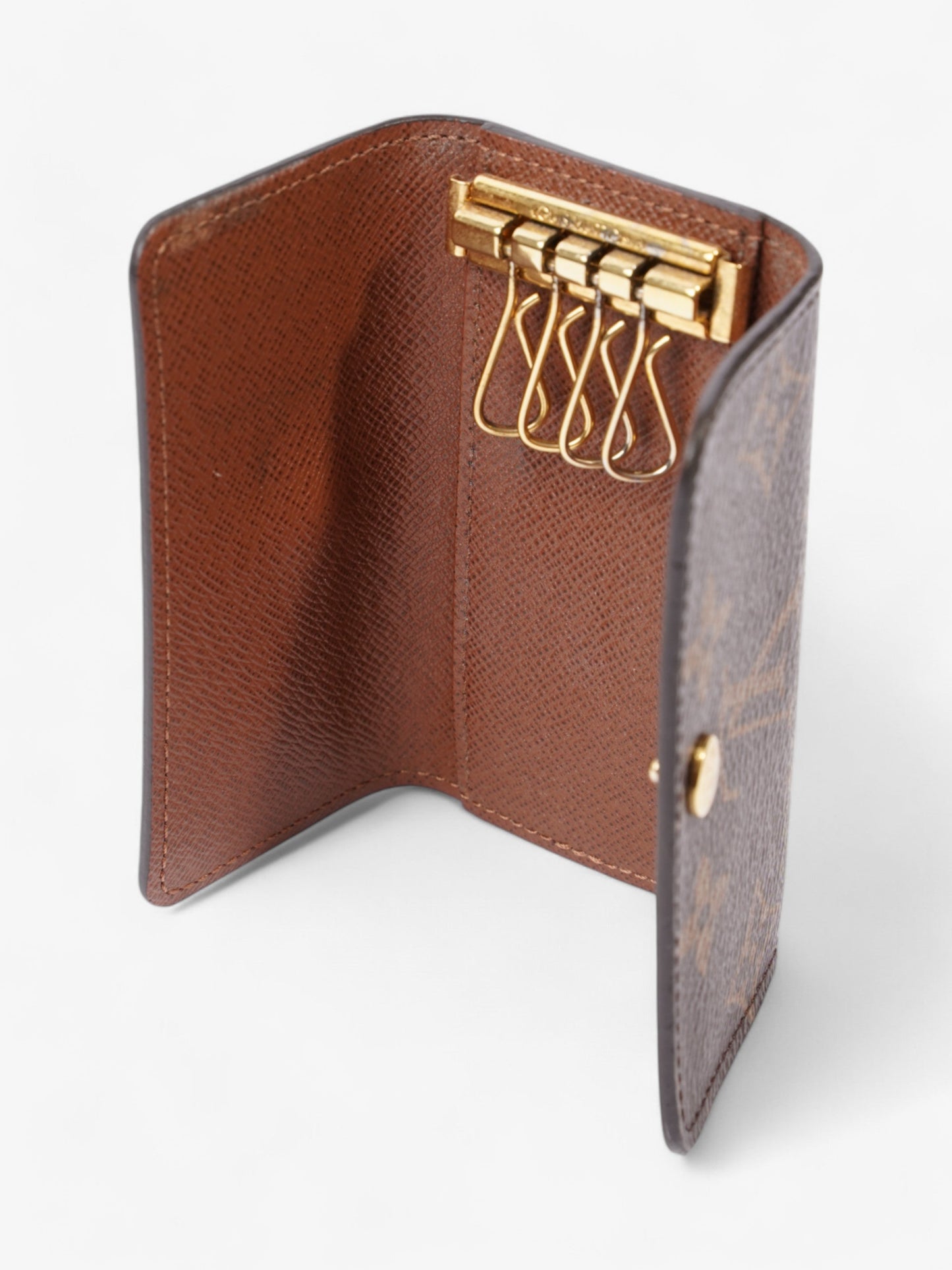 Louis Vuitton 4 Key Holder Monogram / Gold Coated Canvas