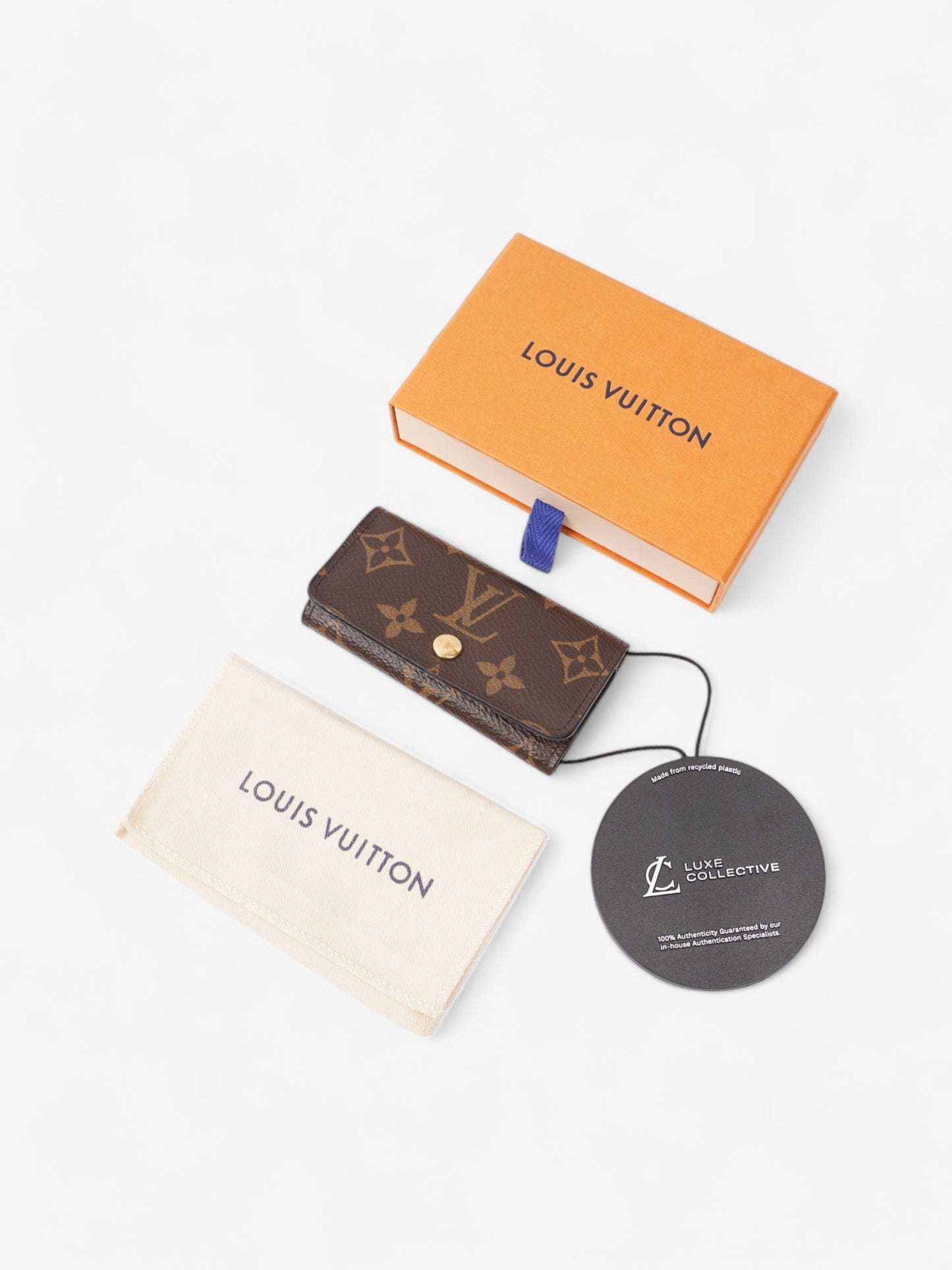 Louis Vuitton 4 Key Holder Monogram / Gold Coated Canvas
