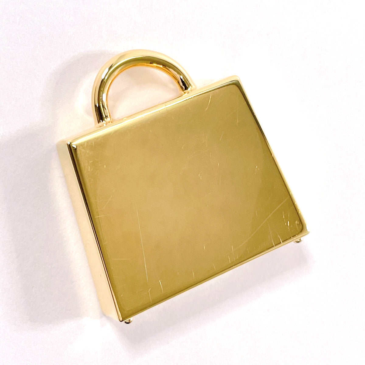 HERMES charm metal gold Curio Jite Kelly