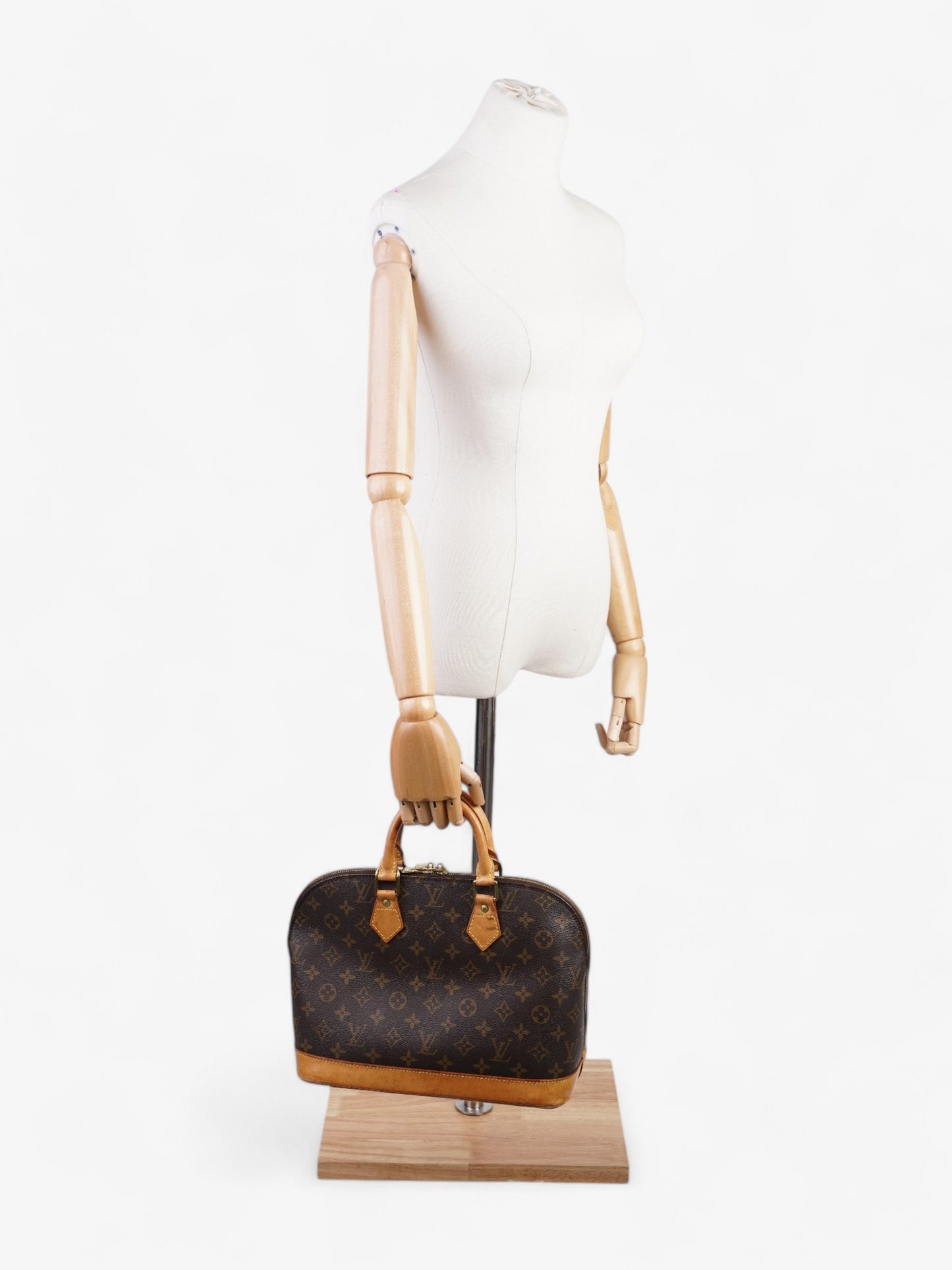 Louis Vuitton Alma Monogram Coated Canvas PM