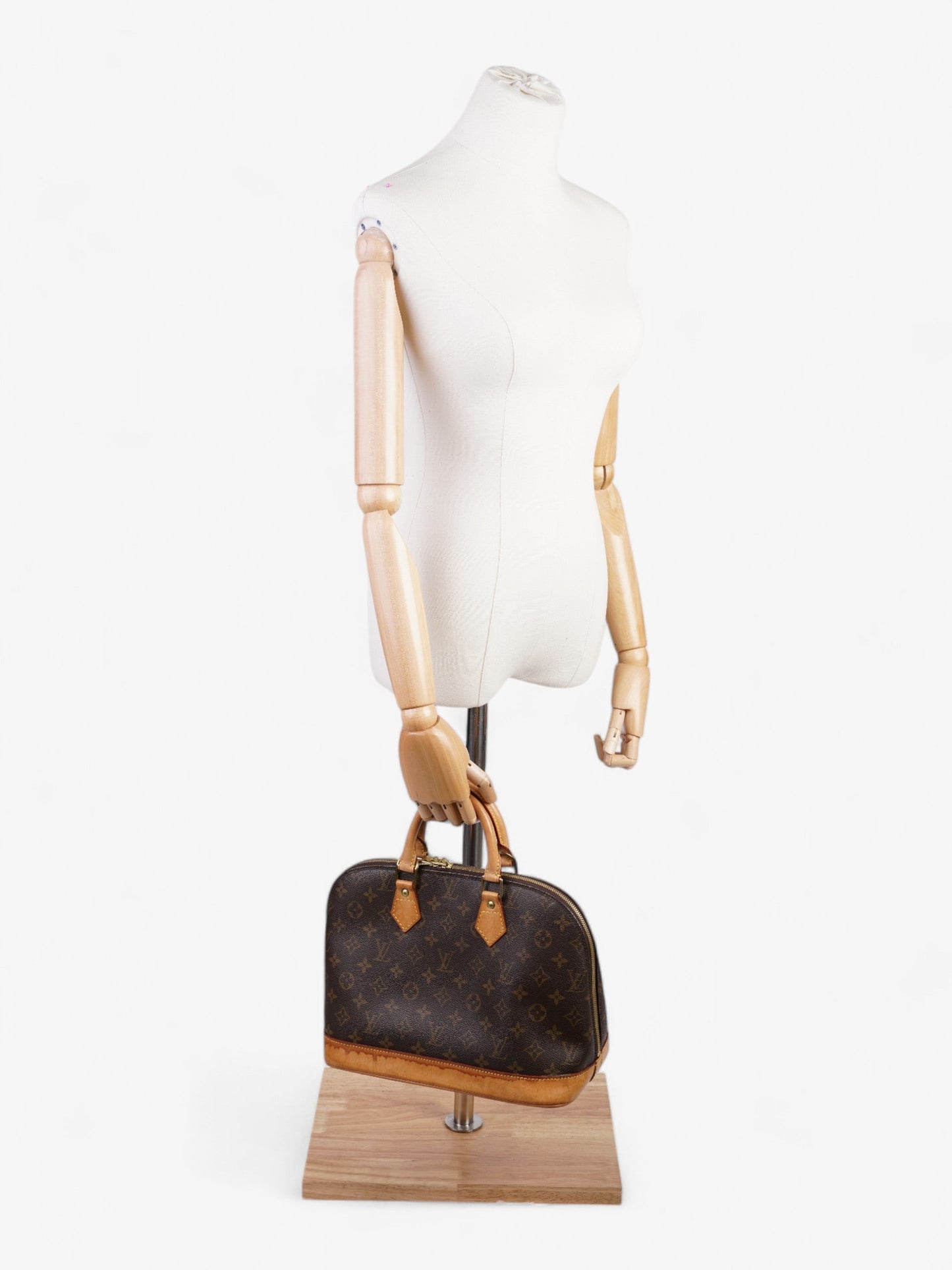 Louis Vuitton Alma Monogram Coated Canvas PM