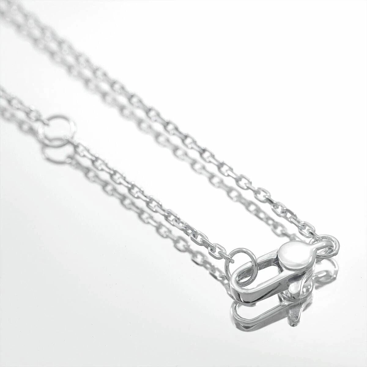 Gucci sterling silver four leaf clover pendant with G logo cut-out on an 18" chain