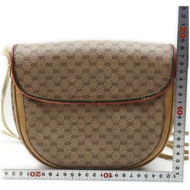 Gucci, rare, brown micro Guccissima print coated canvas/leather saddle bag with red and green inlaid leather stripes