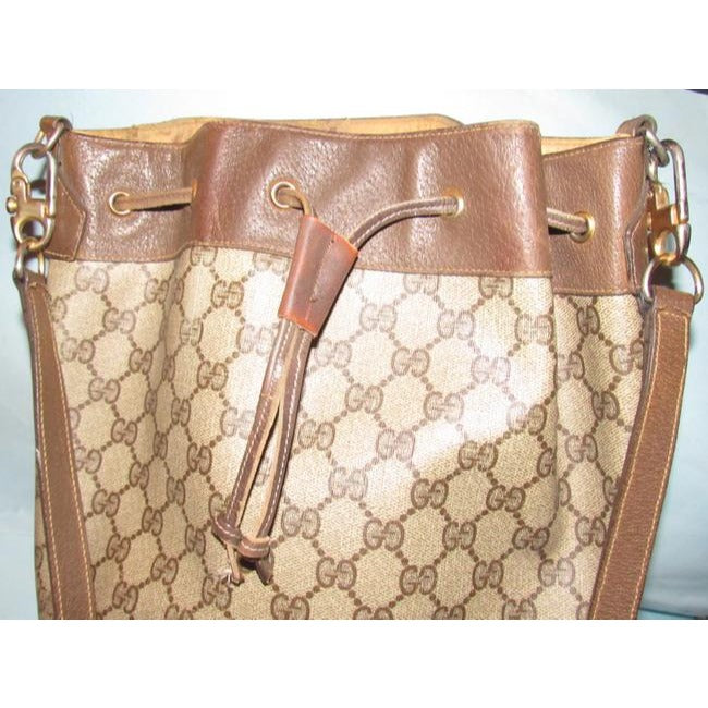 Gucci brown Guccissima print coated canvas & brown leather drawstring top Bucket Bag w red & green striped bottom