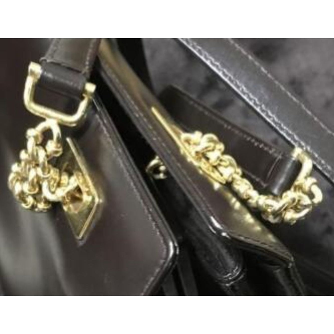Gucci, unique, brown leather, large satchel style  shoulder bag with a snap hinged top, two longer gold chain & leather shoulder straps