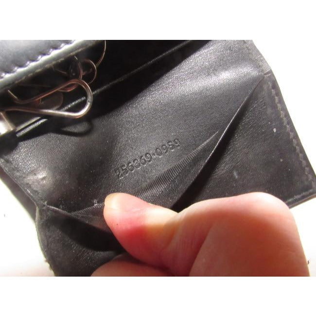 Gucci, black leather, snap close, tri-fold, key holder/card holder, mini- wallet w chrome accents & slots for your cards & six key holders