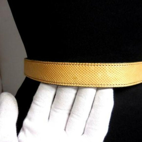Gucci tan lizard leather belt w engraved chrome buckle