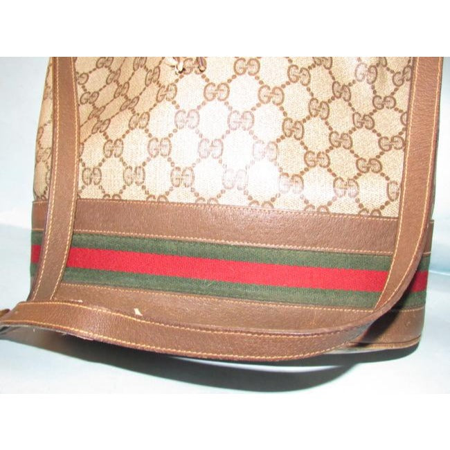 Gucci brown Guccissima print coated canvas & brown leather drawstring top Bucket Bag w red & green striped bottom