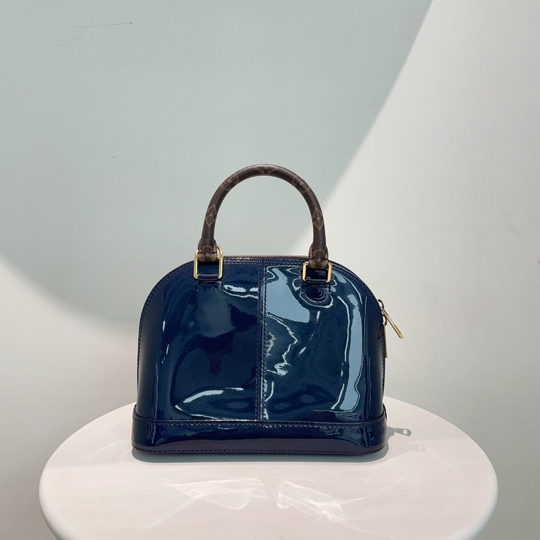 Louis Vuitton Alma Bag in Patent Navy Blue with Monogram Handles and Strap - Medium Size