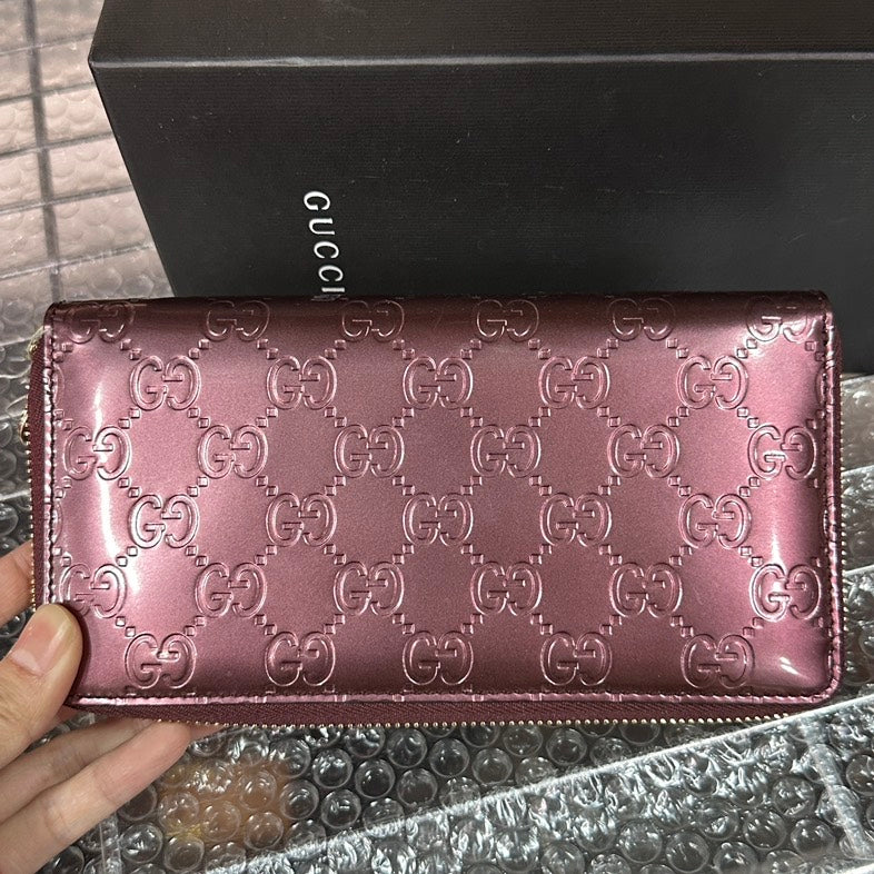 Gucci GG Embossed Burgundy Leather Wallet