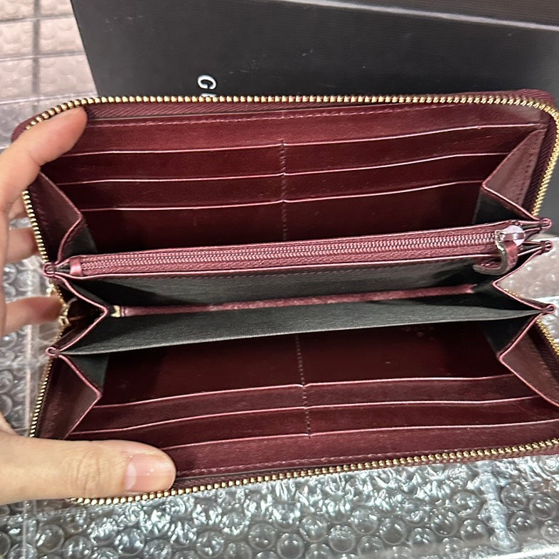 Gucci GG Embossed Burgundy Leather Wallet