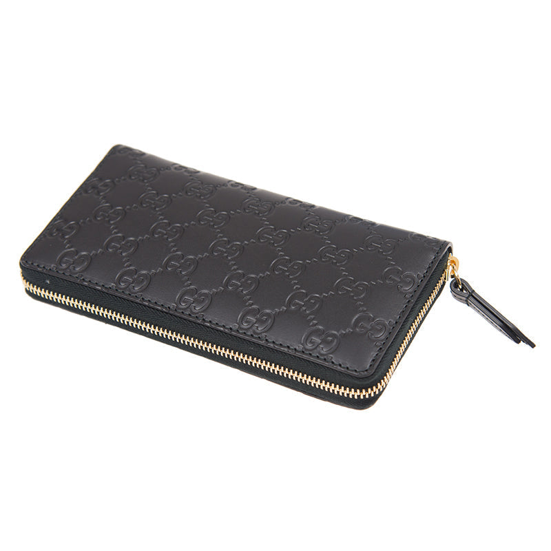 Gucci Interlocking GG Embossed Leather Zip Around Wallet in Black